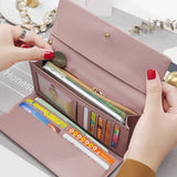 Women's hand holding wallet female long section 2020 new Japanese and Korean personality pendant multi-function student wallet