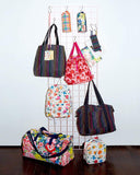 Ban.do Getaway Weekender Bag, Carry On Bag with Exterior Sleeve to Secure to Luggage, Disco Stripe