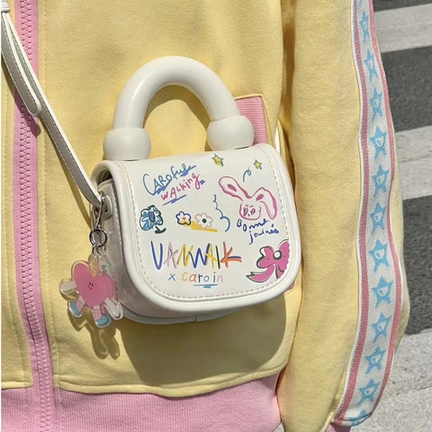 Mini cute foreign cartoon graffiti bag girl 0 spring/summer new Korean version student crossbody bag tote bag tide